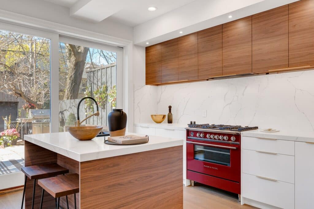 Clean white trend modern kitchen design featuring quartz kitchen top accented with wooden maroon kitchen furnishings. Design and renovated by Wonderful Kitchens Australia. Showroom available at Wonderful Kitchens.